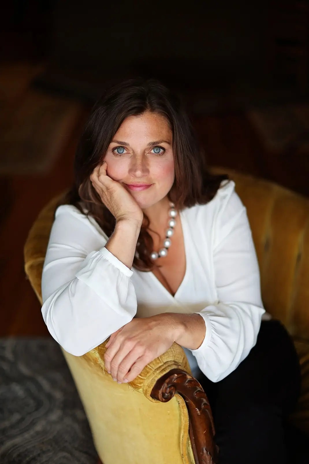 Natalie Stone, PMHNP-BC, seated portrait